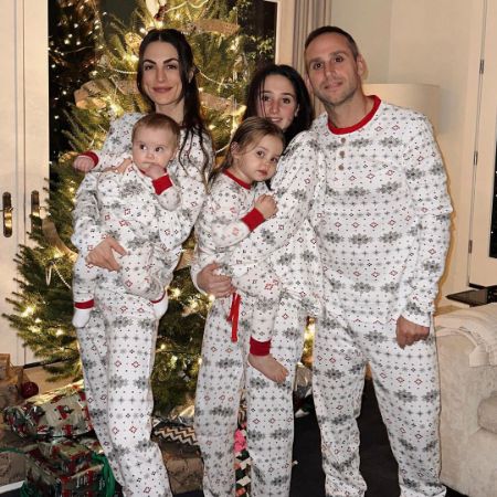 Michael Rubin, Camille Fishel, and their three kids took a picture on Christmas.
